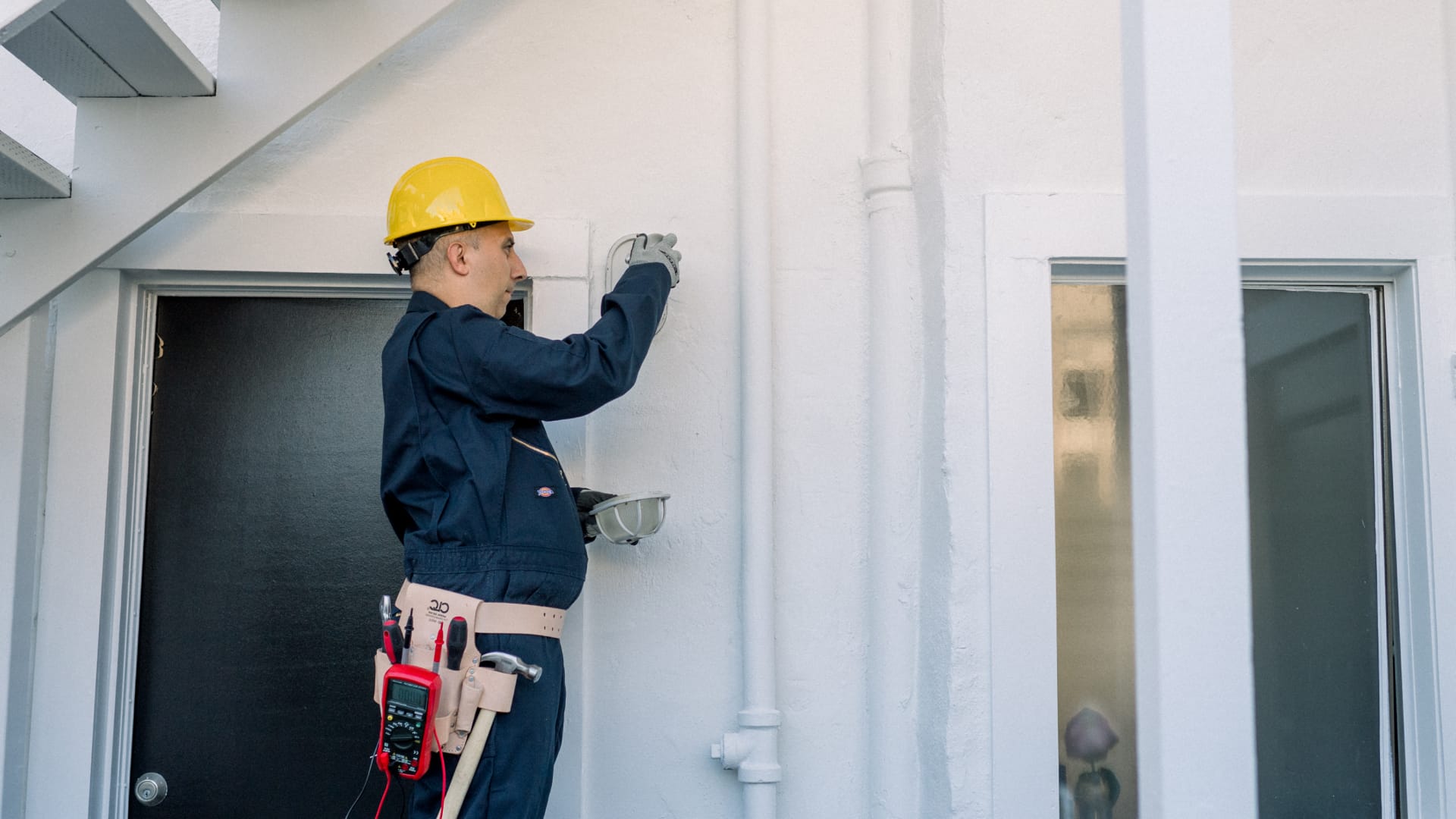 A licensed electrician performs a commercial EV charger installation.